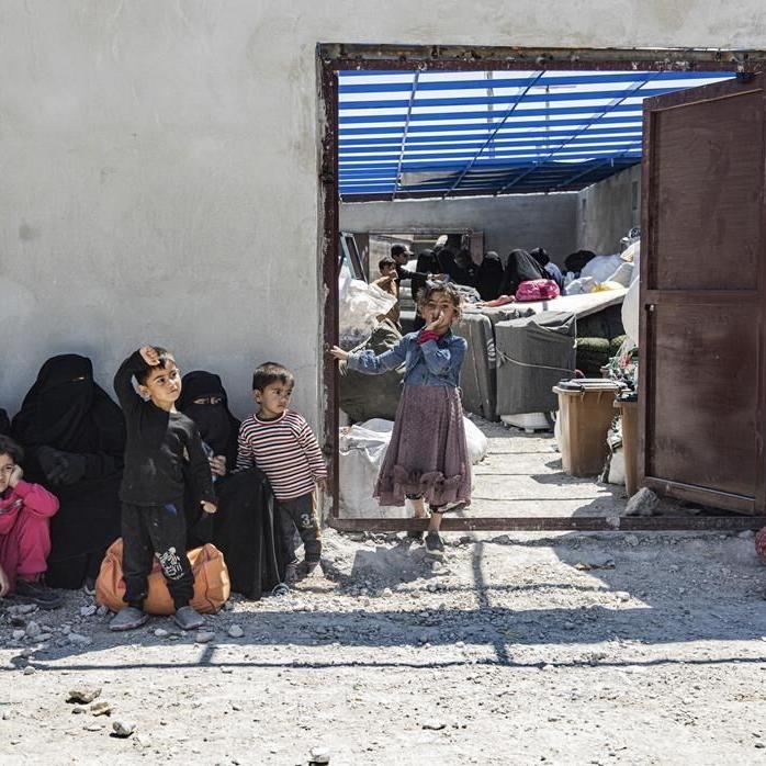 Scores of Syrians return home after years at camp housing people linked to the Islamic State group